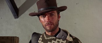 Movie still from “A Fistful of Dollars” (1964), directed by Sergio Leone – A person wearing a hat; Close Up shot, Low angle
