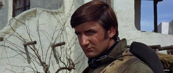 Movie still from “A Fistful of Dollars” (1964), directed by Sergio Leone – A person wearing a jacket; Close Up shot, Low angle