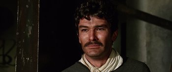 Movie still from “A Fistful of Dollars” (1964), directed by Sergio Leone – A person wearing a neck tie; Close Up shot, Low angle