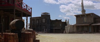 Movie still from “A Fistful of Dollars” (1964), directed by Sergio Leone – An old western style building with a tower on top of it; Extreme Wide shot, Low angle