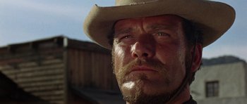 Movie still from “A Fistful of Dollars” (1964), directed by Sergio Leone – A person wearing a hat; Close Up shot, Low angle