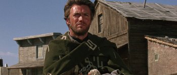 Movie still from “A Fistful of Dollars” (1964), directed by Sergio Leone – A person wearing a blanket; Close Up shot, Low angle