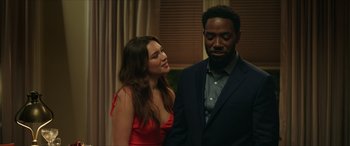 Movie still from “A Good Person” (2023), directed by Zach Braff – A man and a woman standing next to each other; Medium shot, Over the shoulder angle