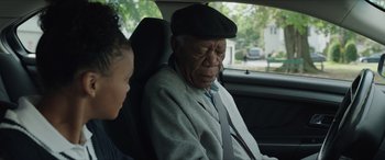 Movie still from “A Good Person” (2023), directed by Zach Braff – An older man sitting in a car with a young girl; Close Up shot, Over the shoulder angle