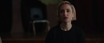 Movie still from “A Good Person” (2023), directed by Zach Braff – A person wearing a black shirt; Close Up shot, Over the shoulder angle