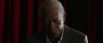 Movie still from “A Good Person” (2023), directed by Zach Braff – An old man with a beard and a suit; Close Up shot, Low angle