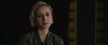 Movie still from “A Good Person” (2023), directed by Zach Braff – A person with short blonde hair; Close Up shot, Over the shoulder angle