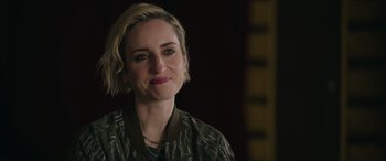 Movie still from “A Good Person” (2023), directed by Zach Braff – A person with short blonde hair; Close Up shot, Over the shoulder angle