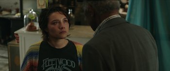 Movie still from “A Good Person” (2023), directed by Zach Braff – A young woman and an older man are talking to each other; Close Up shot, Over the shoulder angle