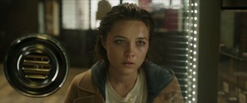Movie still from “A Good Person” (2023), directed by Zach Braff – A young woman is looking into the camera; Close Up shot, Over the shoulder angle