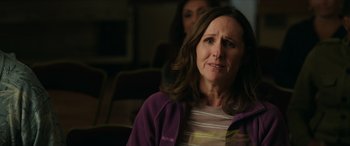 Movie still from “A Good Person” (2023), directed by Zach Braff – A person sitting on a chair; Close Up shot, Over the shoulder angle