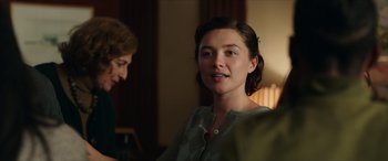 Movie still from “A Good Person” (2023), directed by Zach Braff – A woman sitting in front of another woman in a room; Close Up shot, Over the shoulder angle