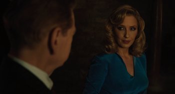 Movie still from “A Haunting in Venice” (2023), directed by Kenneth Branagh – A man and a woman are looking at one another in a mirror; Close Up shot, Over the shoulder angle