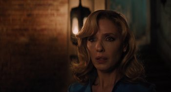 Movie still from “A Haunting in Venice” (2023), directed by Kenneth Branagh – A person wearing a blue shirt; Close Up shot, Over the shoulder angle