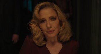 Movie still from “A Haunting in Venice” (2023), directed by Kenneth Branagh – A person with blonde hair; Close Up shot, Over the shoulder angle