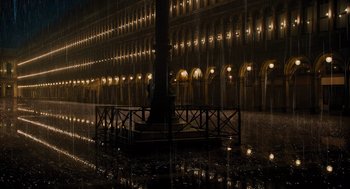 Movie still from “A Haunting in Venice” (2023), directed by Kenneth Branagh – A building that has been lit up at night; Extreme Wide shot, High angle