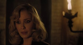 Movie still from “A Haunting in Venice” (2023), directed by Kenneth Branagh – A person wearing a black shirt; Close Up shot, Over the shoulder angle