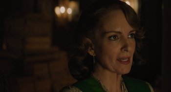 Movie still from “A Haunting in Venice” (2023), directed by Kenneth Branagh – A person wearing a green dress; Close Up shot, Over the shoulder angle