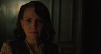 Movie still from “A Haunting in Venice” (2023), directed by Kenneth Branagh – A person wearing a dress; Close Up shot, Over the shoulder angle