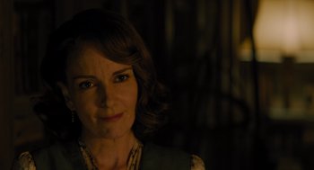 Movie still from “A Haunting in Venice” (2023), directed by Kenneth Branagh – A person wearing a necklace; Close Up shot, Over the shoulder angle