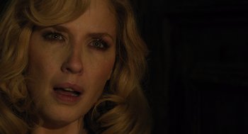 Movie still from “A Haunting in Venice” (2023), directed by Kenneth Branagh – A woman's face in the dark; Close Up shot, Over the shoulder angle