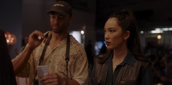 Movie still from “A Hollywood Christmas” (2022), directed by Alex Ranarivelo – A man and a woman standing next to each other; Medium shot, Over the shoulder angle