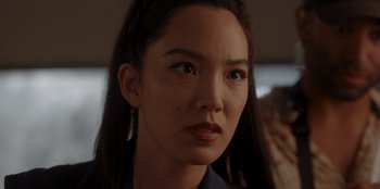 Movie still from “A Hollywood Christmas” (2022), directed by Alex Ranarivelo – A person with long black hair; Close Up shot, Over the shoulder angle