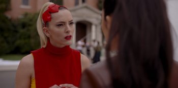 Movie still from “A Hollywood Christmas” (2022), directed by Alex Ranarivelo – A woman in a red dress talking to another woman in a red dress; Close Up shot, Over the shoulder angle