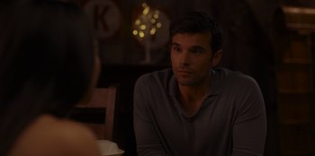 Movie still from “A Hollywood Christmas” (2022), directed by Alex Ranarivelo – A man sitting at a table in front of a woman; Close Up shot, Over the shoulder angle