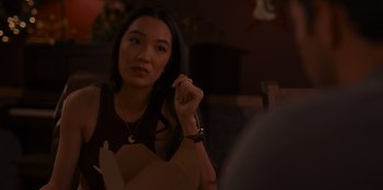 Movie still from “A Hollywood Christmas” (2022), directed by Alex Ranarivelo – A woman sitting in front of a mirror looking at the camera; Close Up shot, Over the shoulder angle