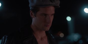 Movie still from “A Hollywood Christmas” (2022), directed by Alex Ranarivelo – A person wearing a hat; Close Up shot, High angle
