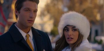 Movie still from “A Hollywood Christmas” (2022), directed by Alex Ranarivelo – A man and a woman wearing fur hats and a suit; Close Up shot, Over the shoulder angle