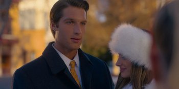 Movie still from “A Hollywood Christmas” (2022), directed by Alex Ranarivelo – A man and a woman wearing a fur hat; Close Up shot, Over the shoulder angle