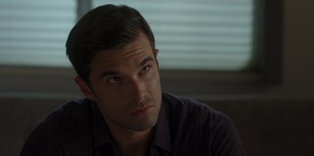 Movie still from “A Hollywood Christmas” (2022), directed by Alex Ranarivelo – A person sitting down with his eyes wide open; Close Up shot, Over the shoulder angle