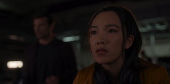 Movie still from “A Hollywood Christmas” (2022), directed by Alex Ranarivelo – A person wearing a yellow jacket; Close Up shot, Over the shoulder angle