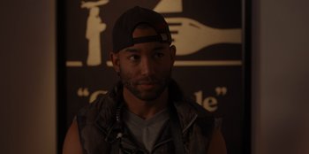 Movie still from “A Hollywood Christmas” (2022), directed by Alex Ranarivelo – A person wearing a cap; Close Up shot, Over the shoulder angle