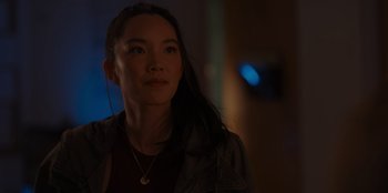 Movie still from “A Hollywood Christmas” (2022), directed by Alex Ranarivelo – A woman with long black hair wearing a black shirt; Close Up shot, Over the shoulder angle