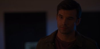 Movie still from “A Hollywood Christmas” (2022), directed by Alex Ranarivelo – A person wearing a jacket; Close Up shot, Over the shoulder angle