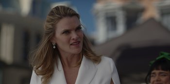 Movie still from “A Hollywood Christmas” (2022), directed by Alex Ranarivelo – A person wearing a white suit jacket; Close Up shot, Low angle