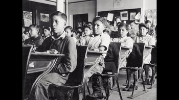 Black and white photograph of students in a class room