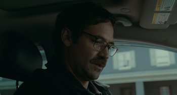 Movie still from “A Man Called Otto” (2022), directed by Marc Forster – A person wearing glasses in a car; Close Up shot, Over the shoulder angle