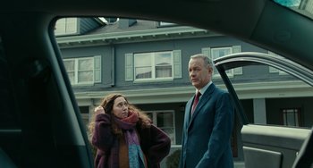 Movie still from “A Man Called Otto” (2022), directed by Marc Forster – A man and a woman standing next to each other in front of a house; Medium shot, Low angle