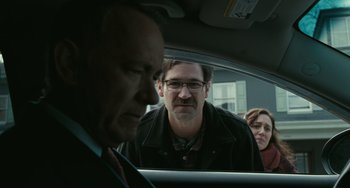 Movie still from “A Man Called Otto” (2022), directed by Marc Forster – A man and two women in a car looking out the window; Close Up shot, Over the shoulder angle