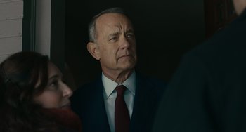 Movie still from “A Man Called Otto” (2022), directed by Marc Forster – An older man wearing a suit and tie; Close Up shot, Over the shoulder angle