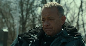 Movie still from “A Man Called Otto” (2022), directed by Marc Forster – An older man with grey hair is looking sad; Close Up shot, Low angle
