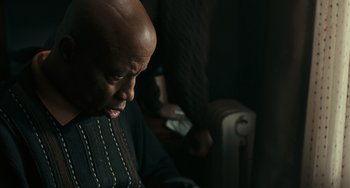Movie still from “A Man Called Otto” (2022), directed by Marc Forster – An older man sitting in front of a computer monitor; Close Up shot, Low angle