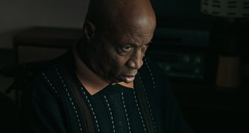 Movie still from “A Man Called Otto” (2022), directed by Marc Forster – An older man with a bald head looking down at the ground; Close Up shot, Low angle
