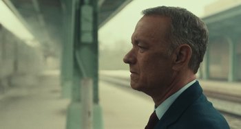 Movie still from “A Man Called Otto” (2022), directed by Marc Forster – An older man in a suit and tie looking to his left; Close Up shot, Low angle