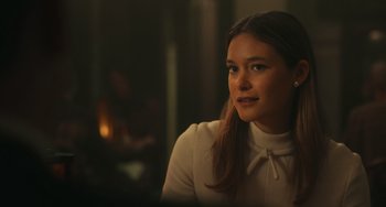 Movie still from “A Man Called Otto” (2022), directed by Marc Forster – A woman sitting in front of a fire place; Close Up shot, Over the shoulder angle