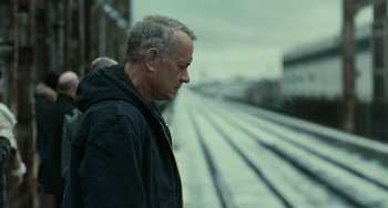 Movie still from “A Man Called Otto” (2022), directed by Marc Forster – A man standing on the side of a train track; Close Up shot, Low angle